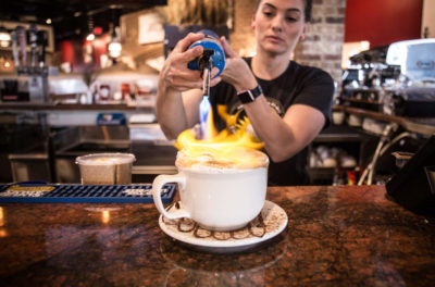 bartender making a drink with a blowtorch