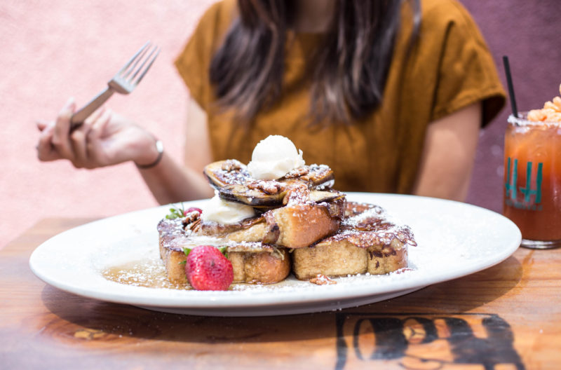 woman eating french toast